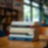 A stack of finance books on a wooden table