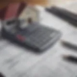 A calculator surrounded by paperwork symbolizing financial analysis