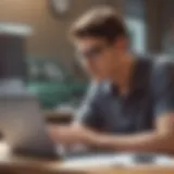 A young adult examining auto insurance options on a laptop