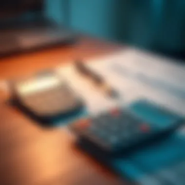 Calculating Tax Refunds Calculator and tax forms on a desk